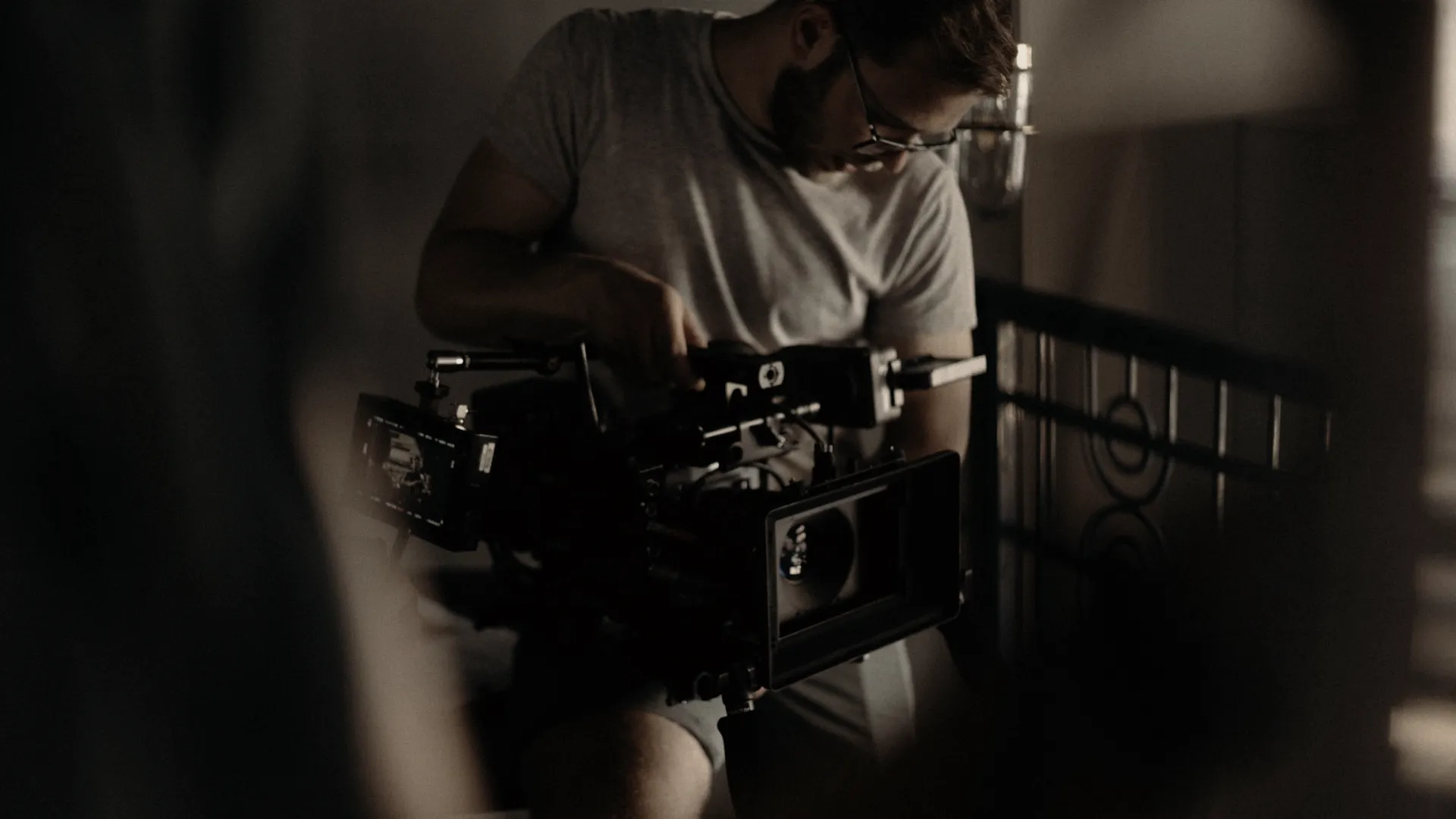 Specialist preparing a camera on set