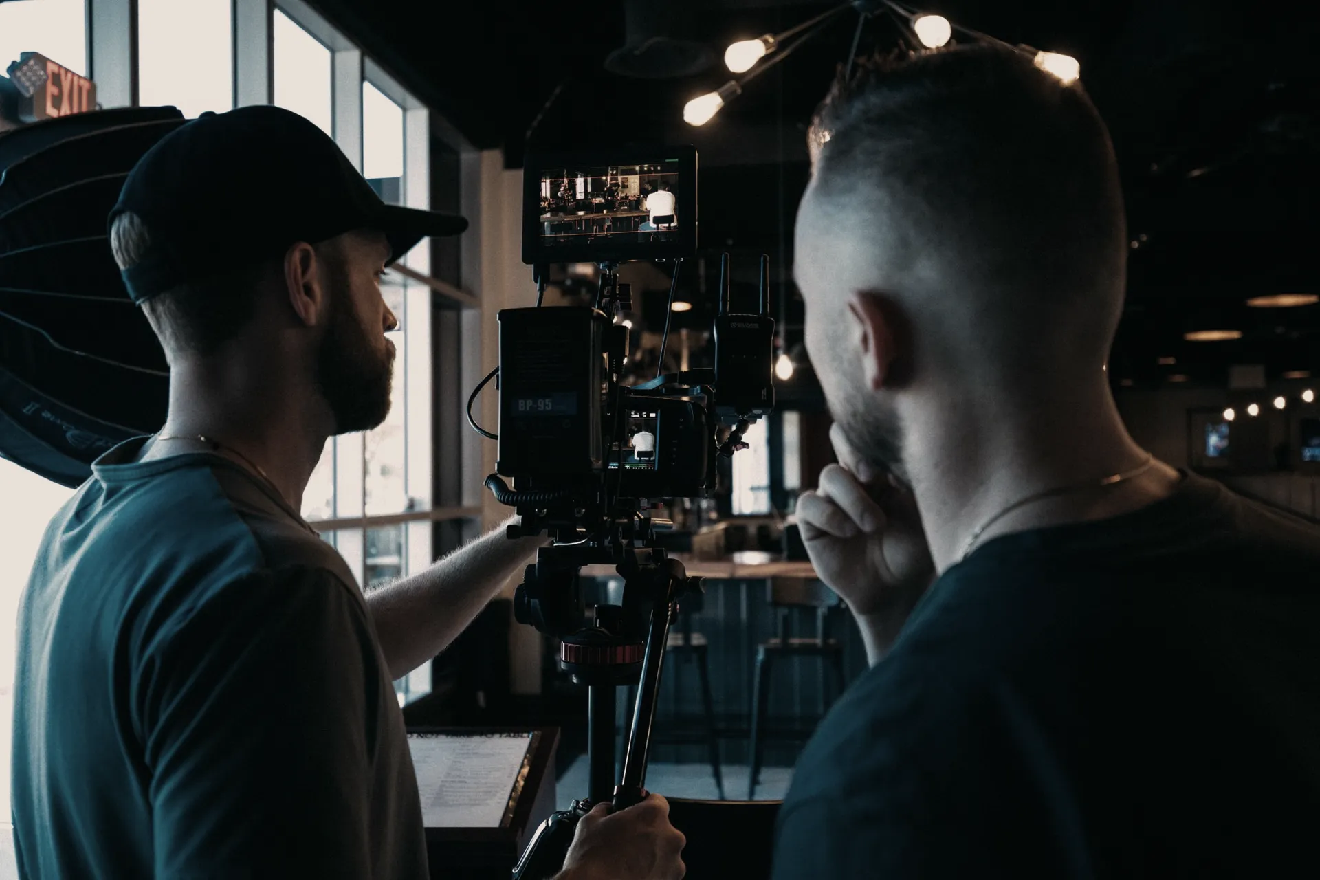 Director and camera operator reviewing a shot